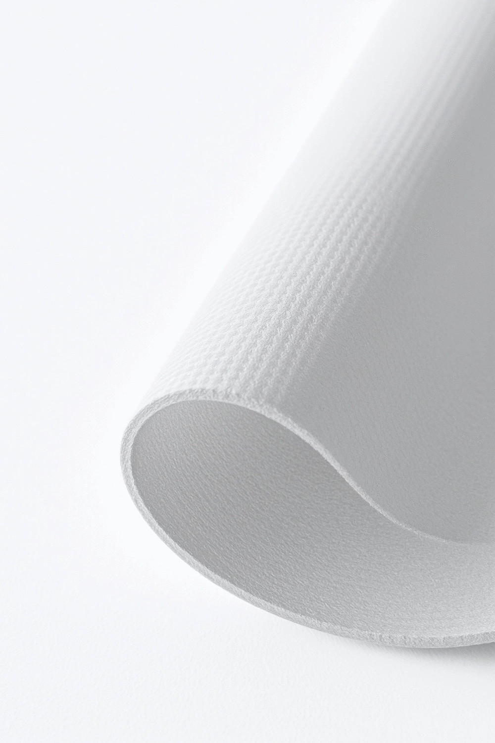 Close-up of a yoga mat showing texture and material, indicating durability and grip