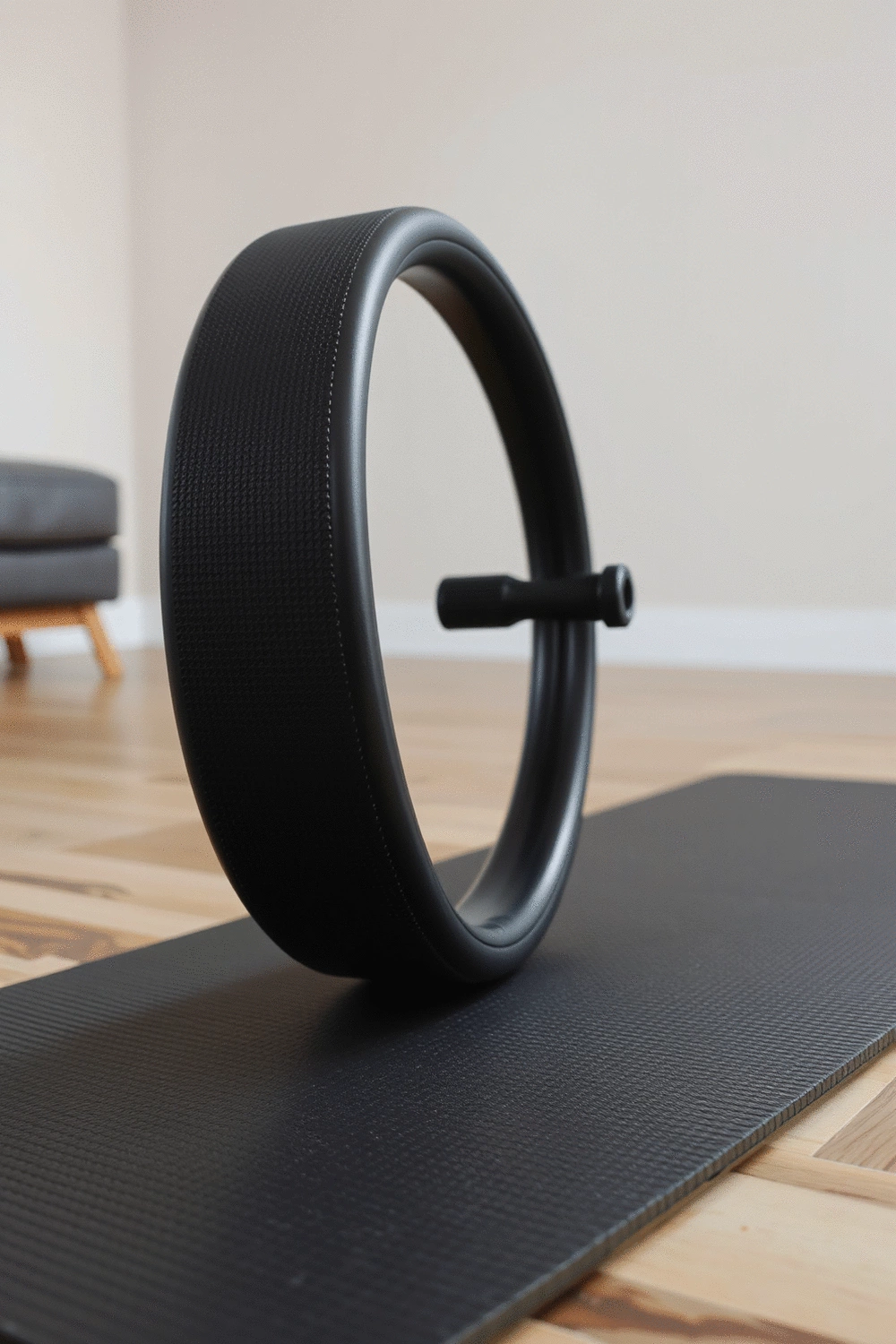 Close-up of a yoga wheel on a textured yoga mat, demonstrating proper alignment and stability.